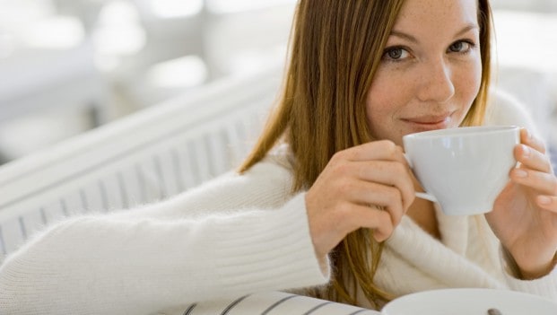 woman drinking tea or coffee