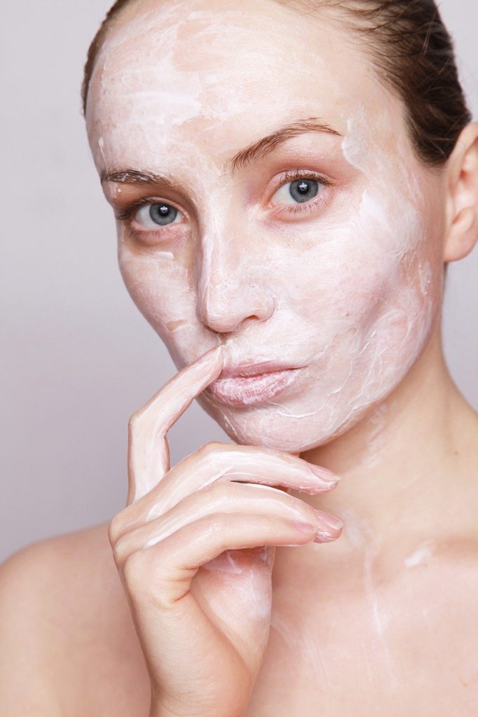 woman with lotion on her face