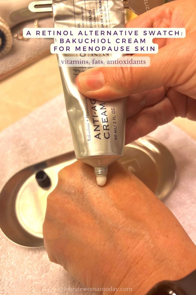 Dab of white bakuchiol cream, a retinol alternative, on the back of a woman's hand beside a metal tray