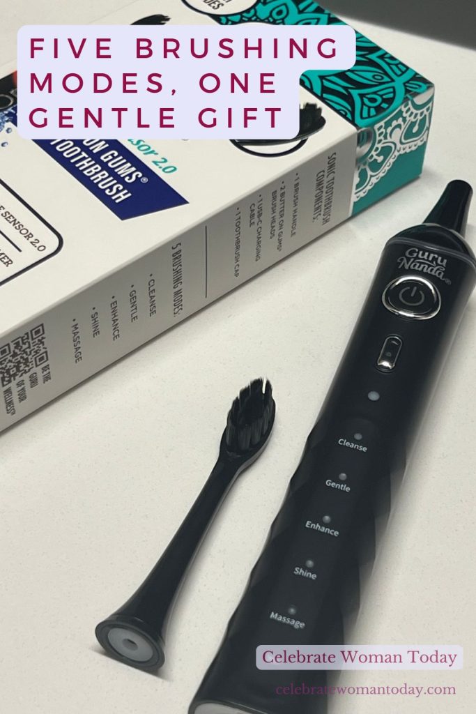 GuruNanda toothbrush handle with five brushing mode lights and a detached black brush head beside the box