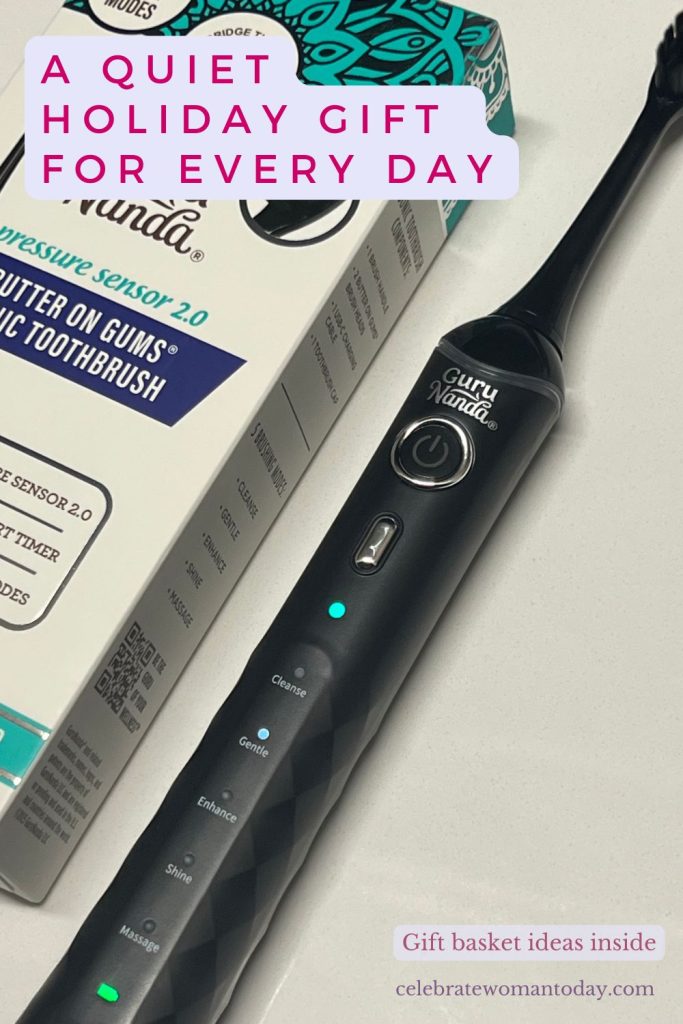 Soft electric toothbrush and its Butter On Gums box on a white counter with a detachable brush head