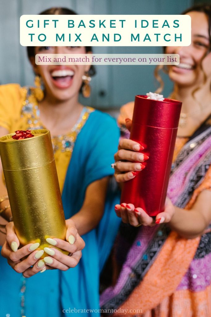 Two women laughing and holding gold and red cylinder gift boxes topped with bows