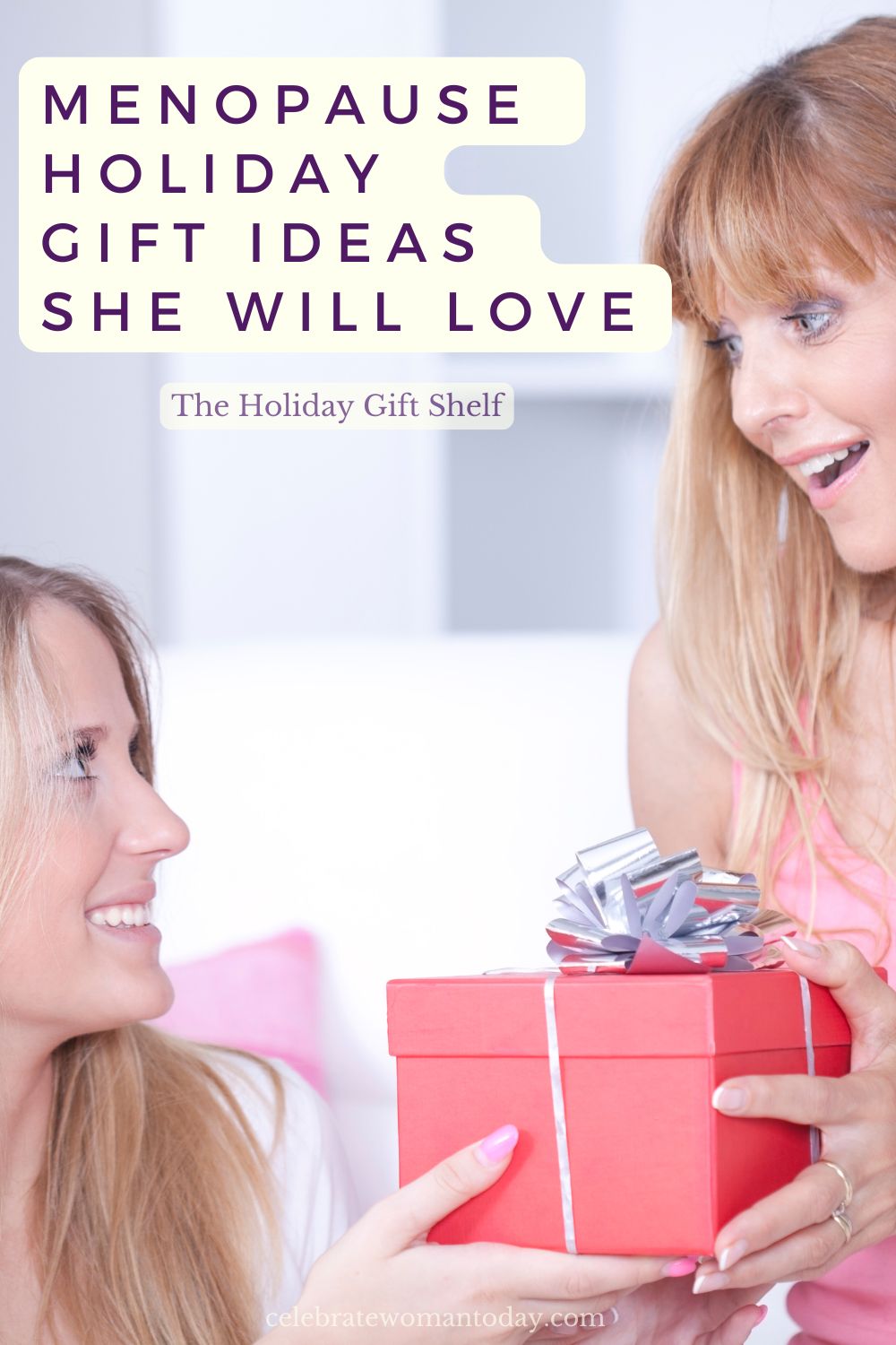 Menopause holiday gift ideas: a delighted woman with bangs receives a red gift box with a silver bow from a smiling friend