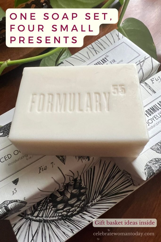 Formulary 55 soap bar on wrapped holiday soaps beside a pothos plant and a decorative tray