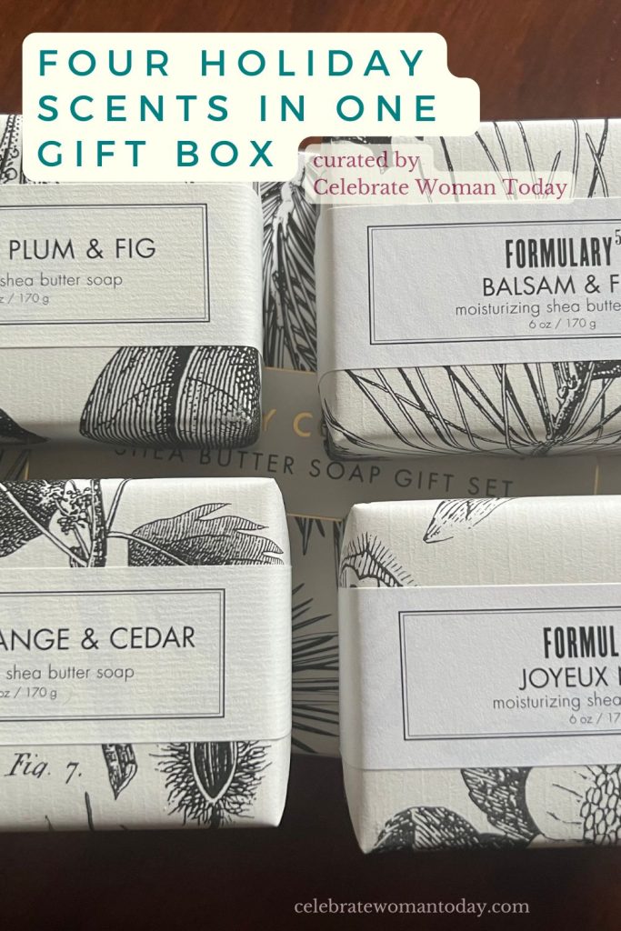 Four wrapped bars from a holiday soap gift set in Balsam and Fir, Spiced Orange and Cedar, Sugared Plum and Fig, and Joyeux Noel
